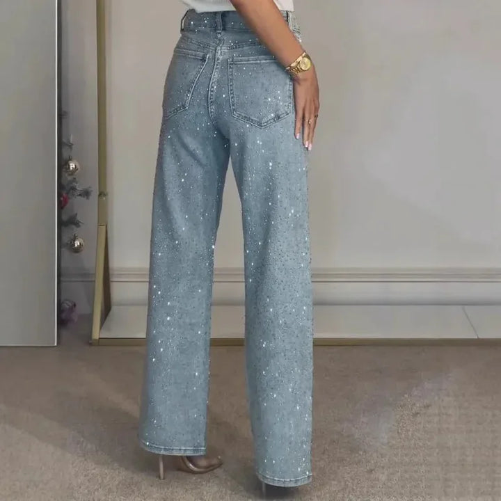 Damskie spodnie z wysokim stanem, szeroką nogawką i cyrkoniami | Rozkloszowany krój